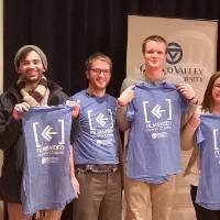 New grads are welcomed into the alumni family with t-shirts